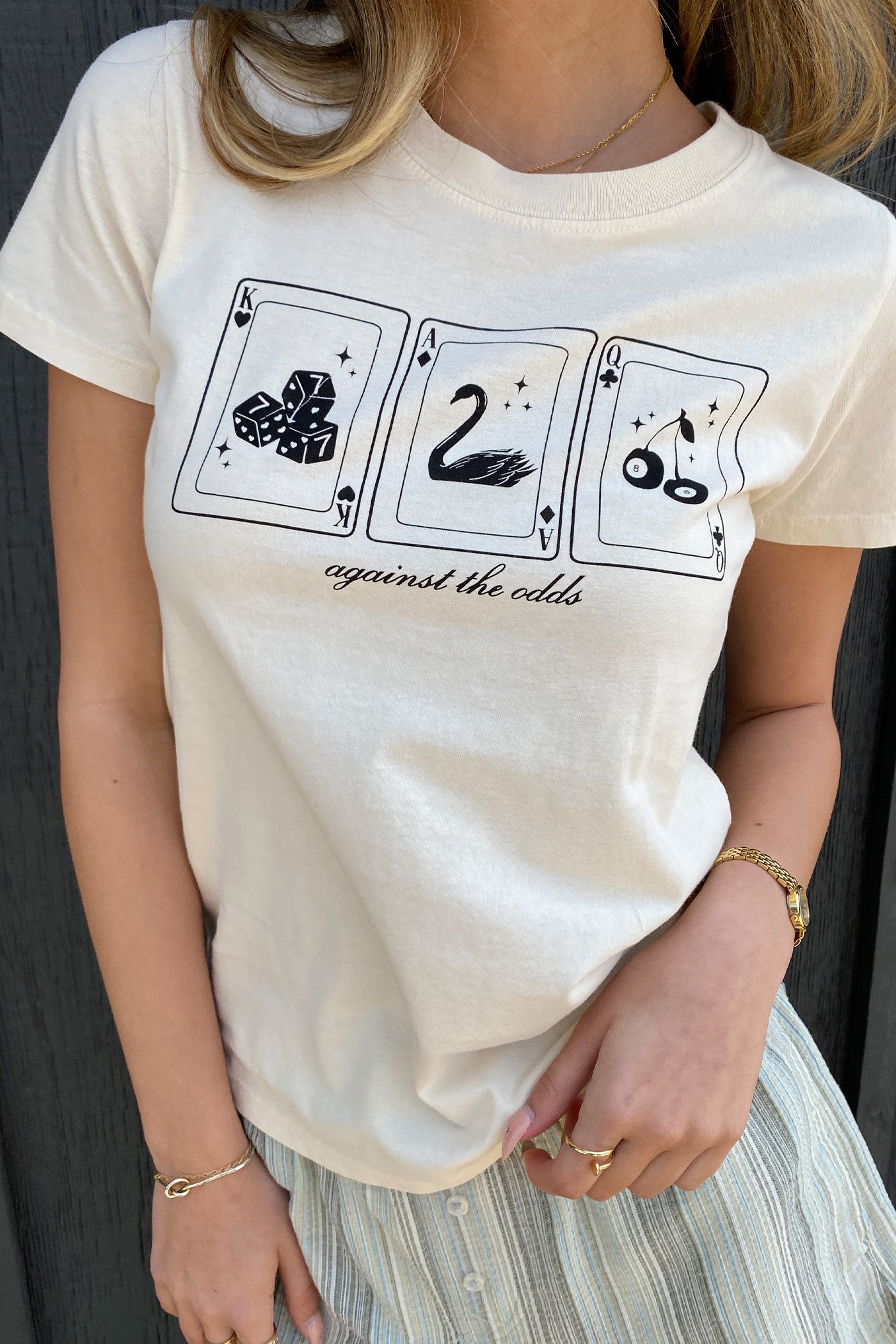 Against The Odds Long Line Graphic Baby Tee