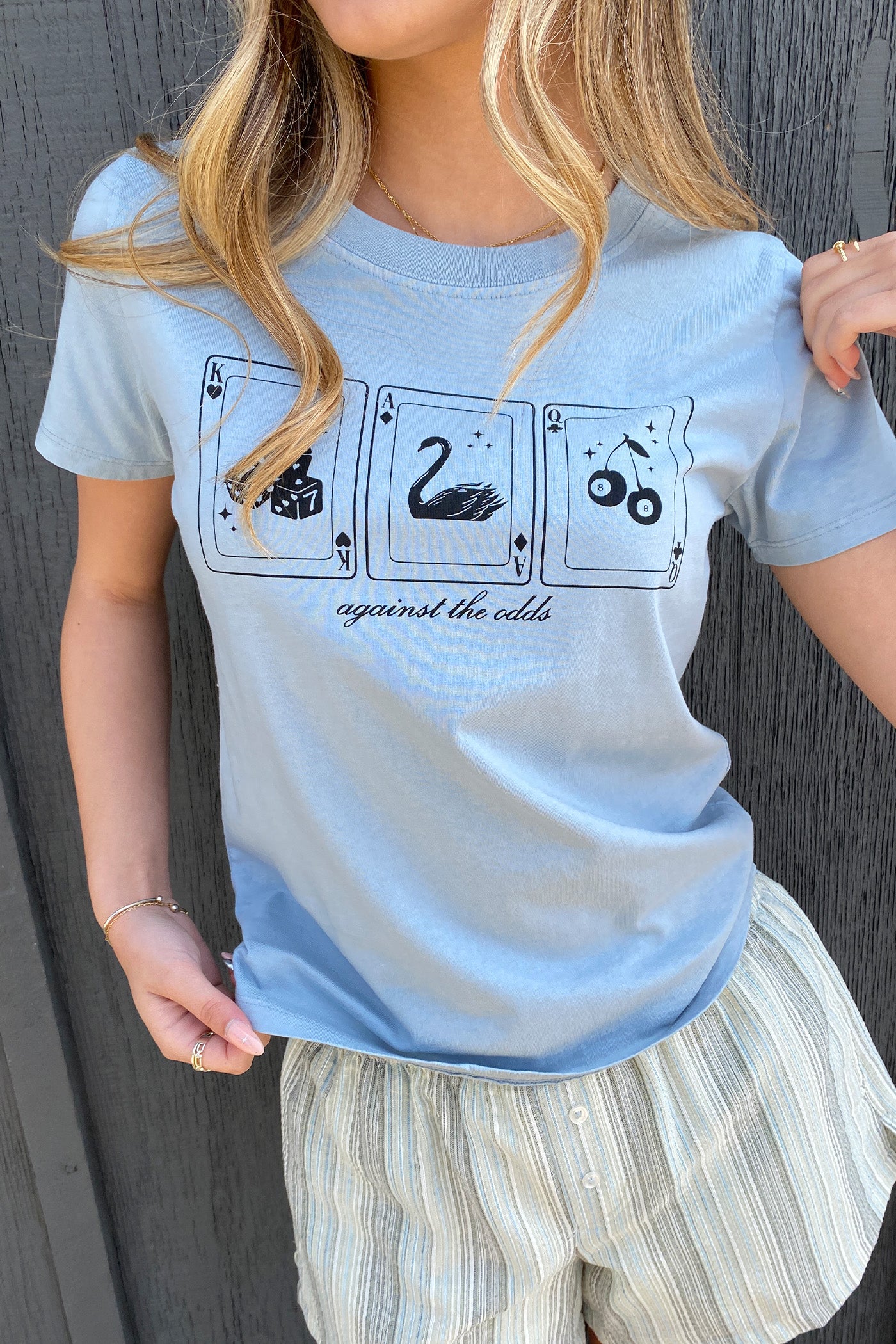 Against The Odds Long Line Graphic Baby Tee