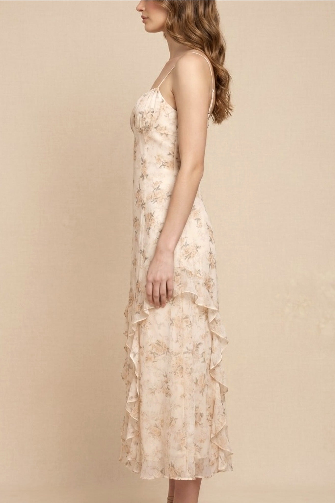 Woman wearing a floral dress against a beige background