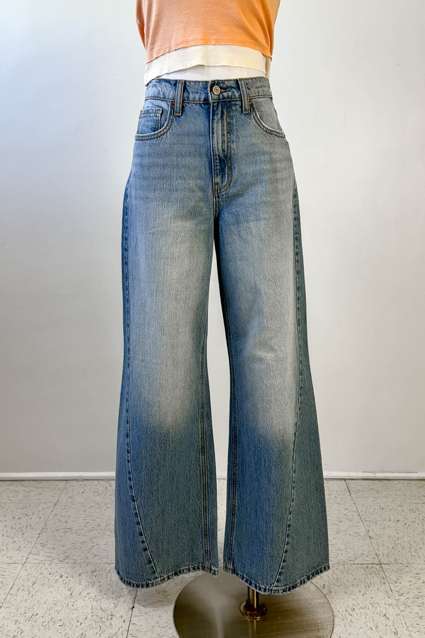 Wide-leg jeans on a mannequin against a white background