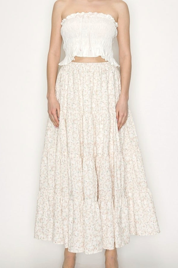 Cream Floral Midi Skirt on Model Standing against blank wall. 