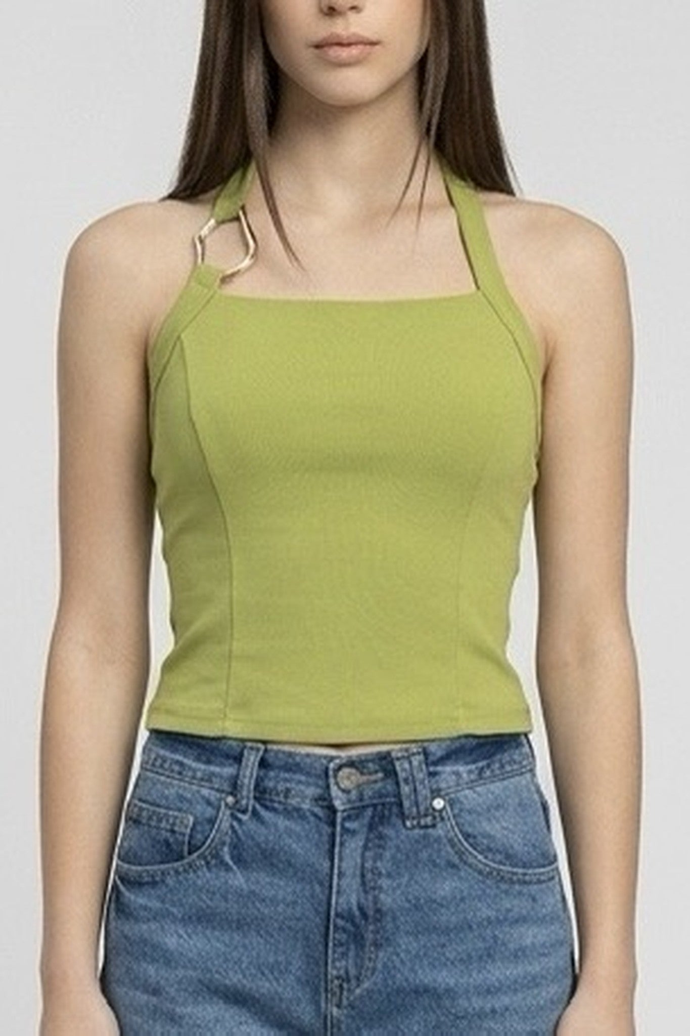 Women wearing green halter top with white background 