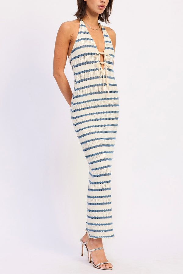 Woman wearing a striped dress on a white background