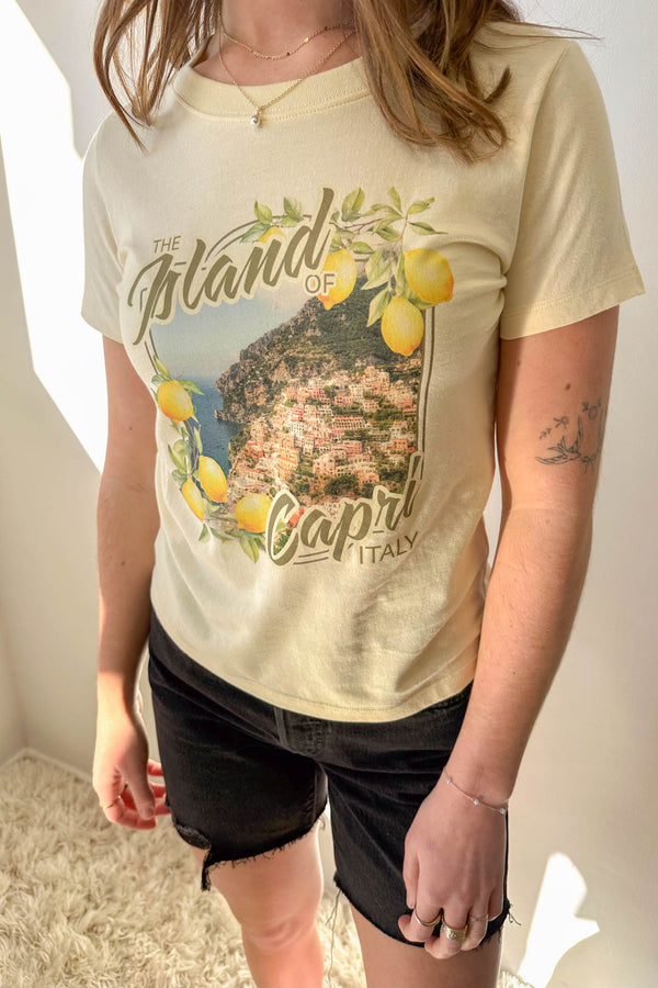 Person wearing a t-shirt with 'Island of Capri Italy' graphic design.